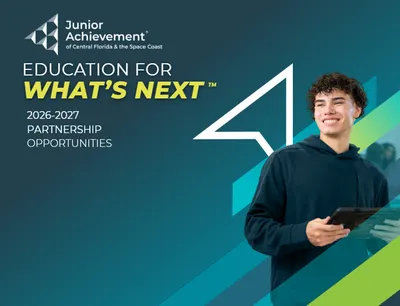 Navy gradient background with a white arrow and a high school-age boy on the right side The left side has the Junior Achievement logo and the words Education for What's Next 2026-2027 and Partnership Opportunities